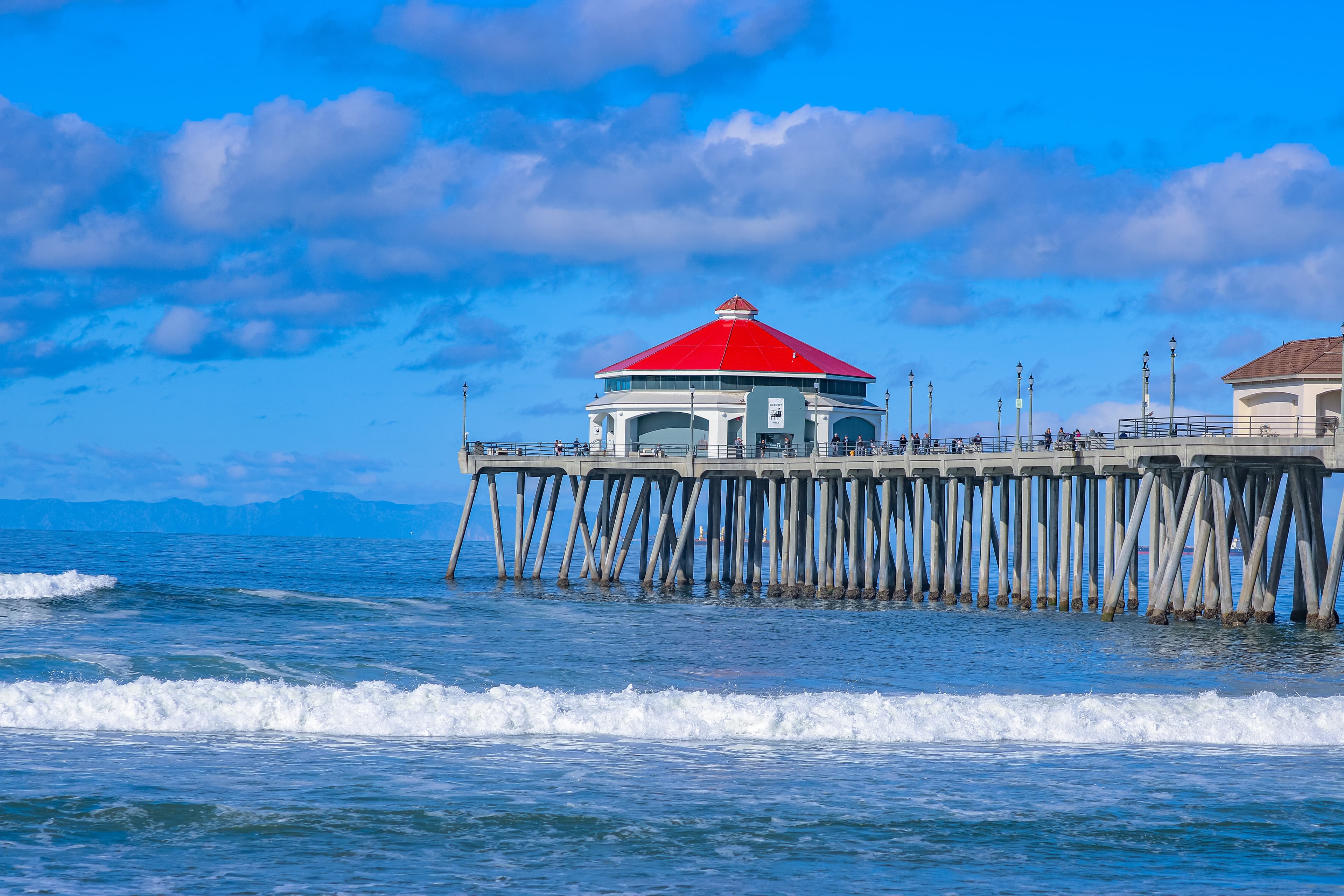 A girl smiling and holding a hula hoop
